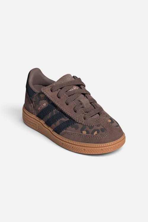 Adidas Kids Handball Spezial shoes in cheetah print with suede overlays and elastic laces.