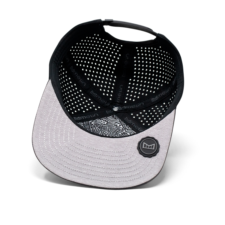 Melin Trenches Icon Hydro Hat in Black