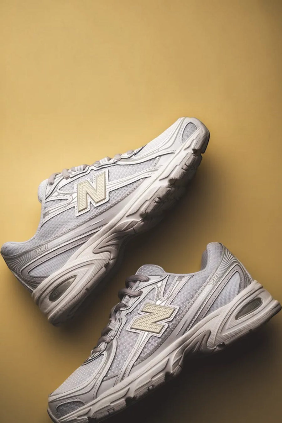 New Balance Women's 740 Sneaker in White, Silver Metallic, and Light Green