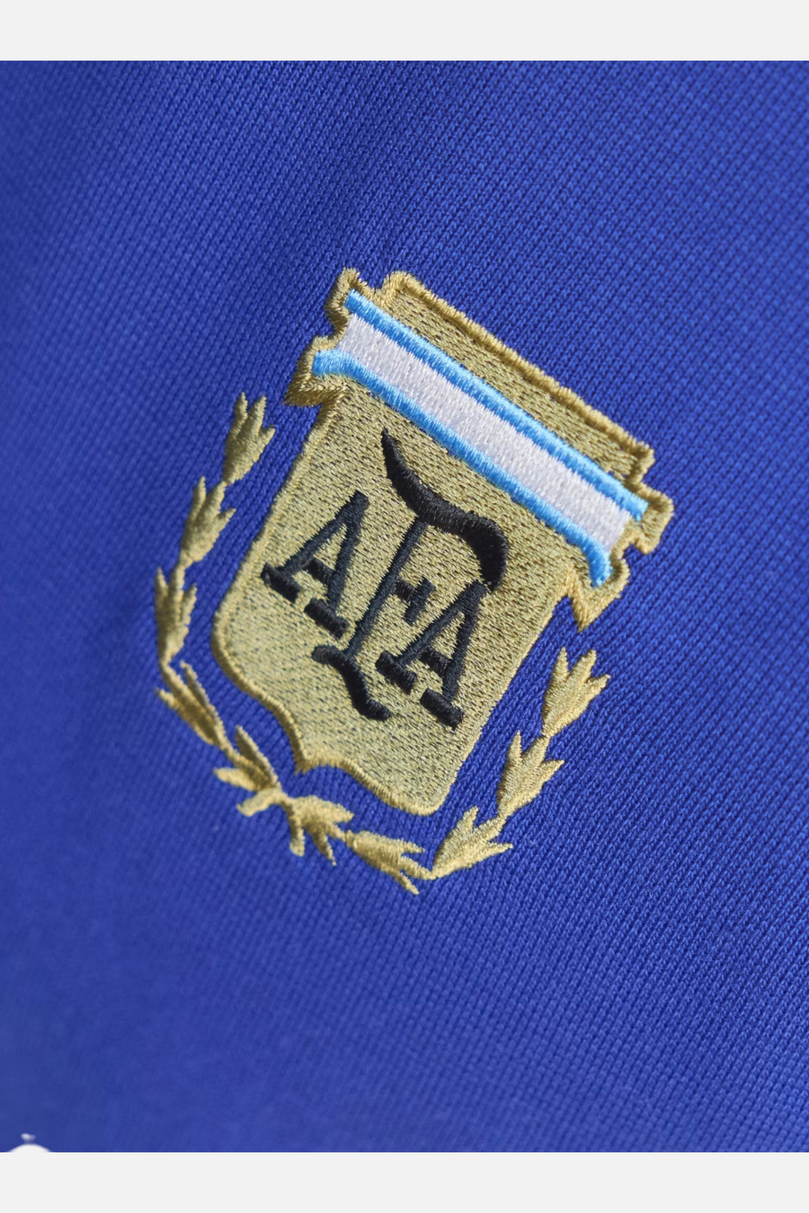 AFA crest embroidery detail on Adidas Argentina Originals Tee in Lucid Blue
