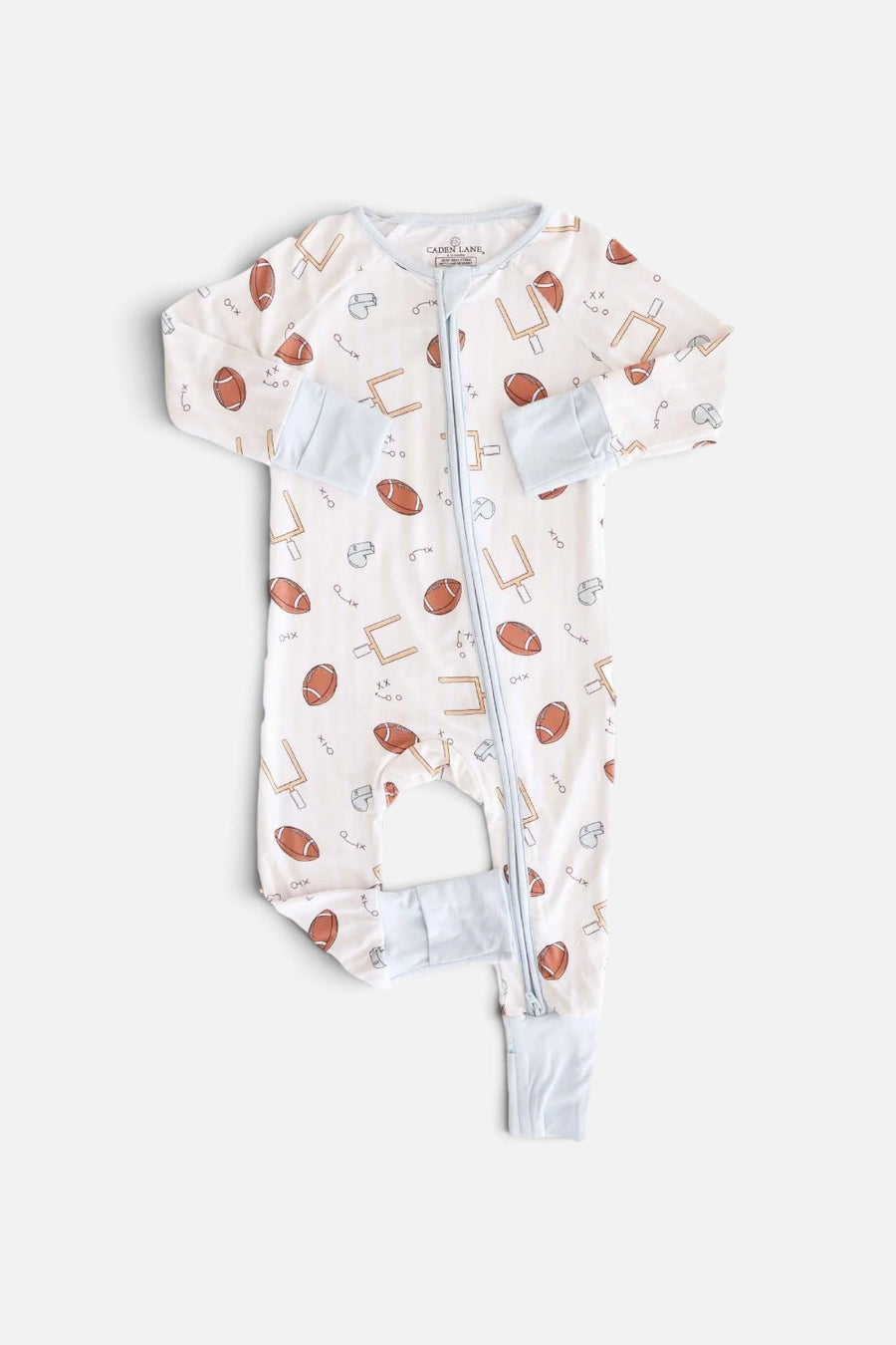Caden Lane Tiny Touchdowns convertible zip romper in a striped football print, front view.