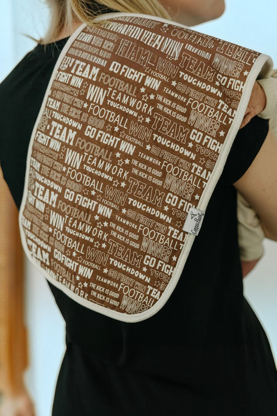 Copper Pearl Blitz burp cloth shown draped over a shoulder.
