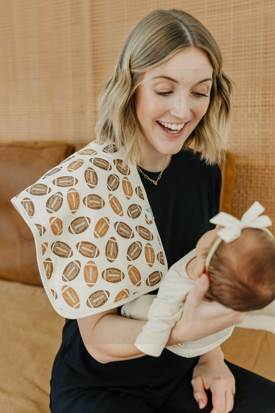 Copper Pearl Blitz burp cloth, football print detail.