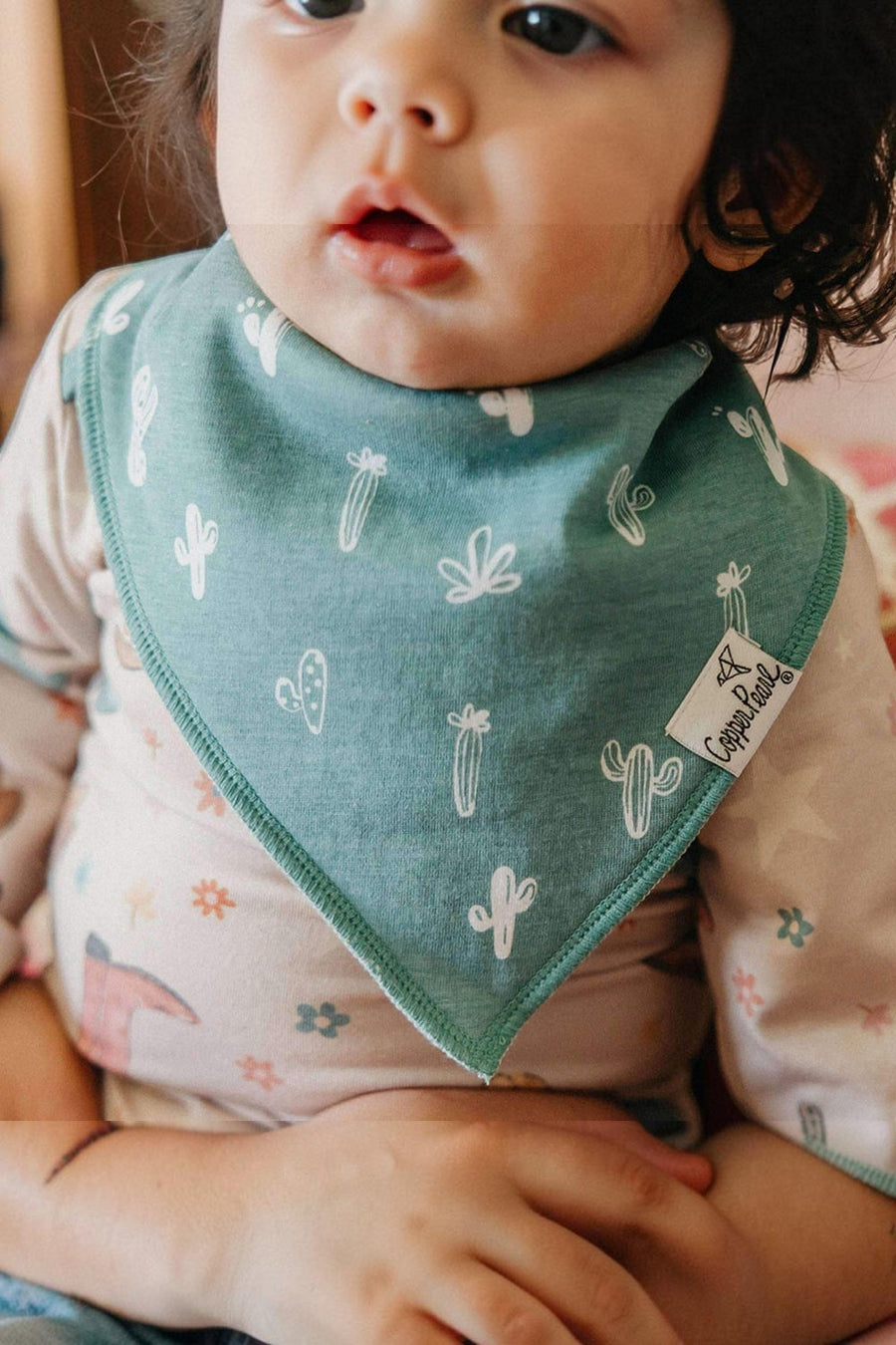 Copper Pearl Cheyenne baby bandana bibs, folded stack.