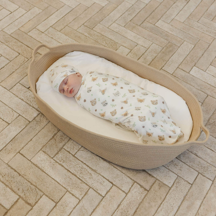 Copper Pearl Wilder swaddle blanket styled in a nursery.