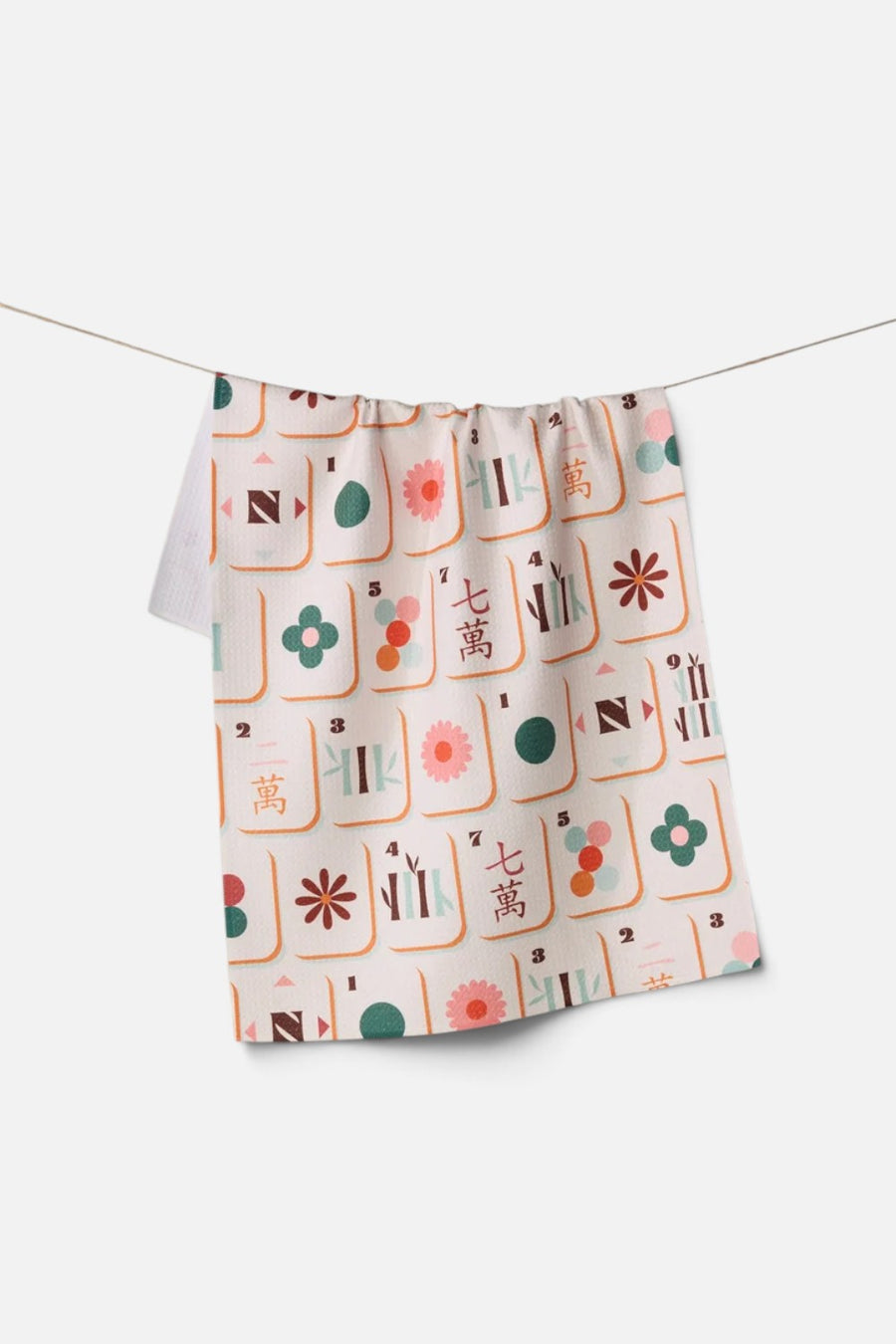 Geometry Towels Cypress Tile Toss tea towel in a multi-color tile print.