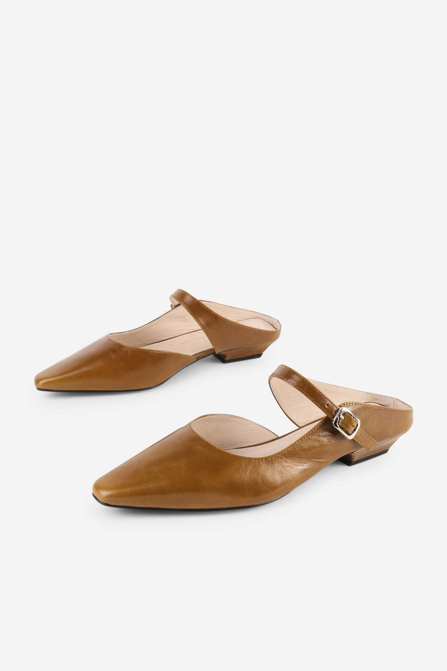Intentionally Blank Nona saddle leather mule in tan, side view.