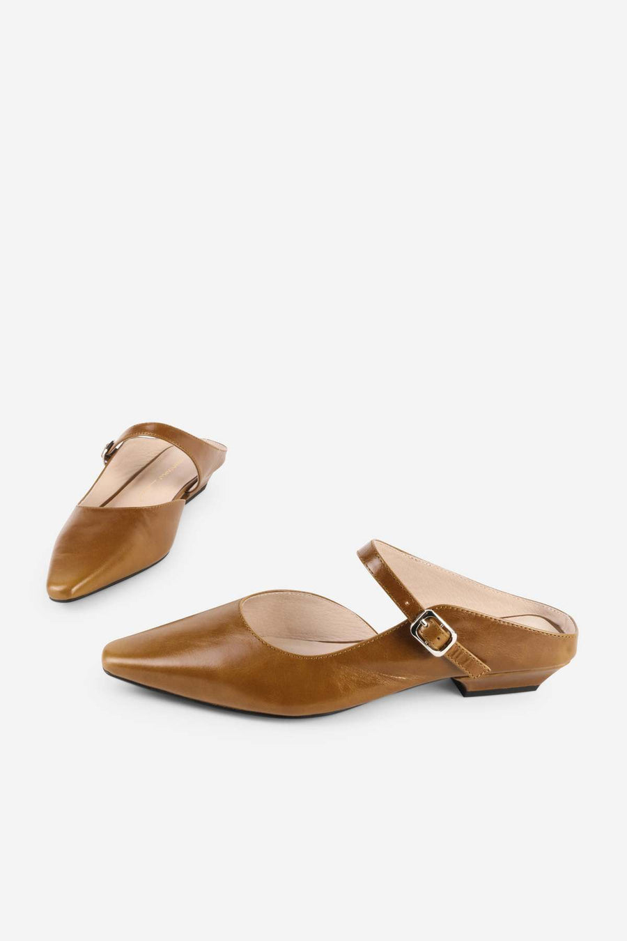 Intentionally Blank Nona saddle leather mule in tan, pair front view.