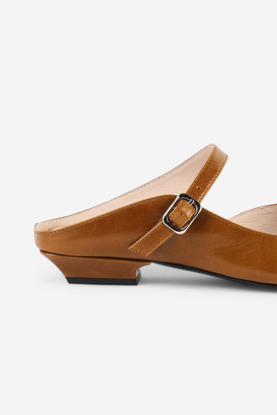 Intentionally Blank Nona saddle leather mule in tan, back view.