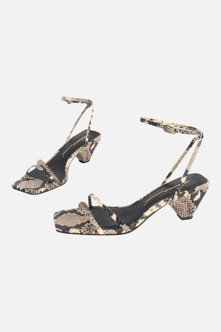 Intentionally Blank Pretty Please Snake Heeled Sandal in Black and White