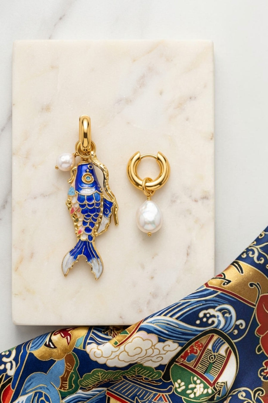 Martha Calvo Barrier hoop earrings in 14KT gold plate with freshwater baroque pearl and blue fish charm, alternate view