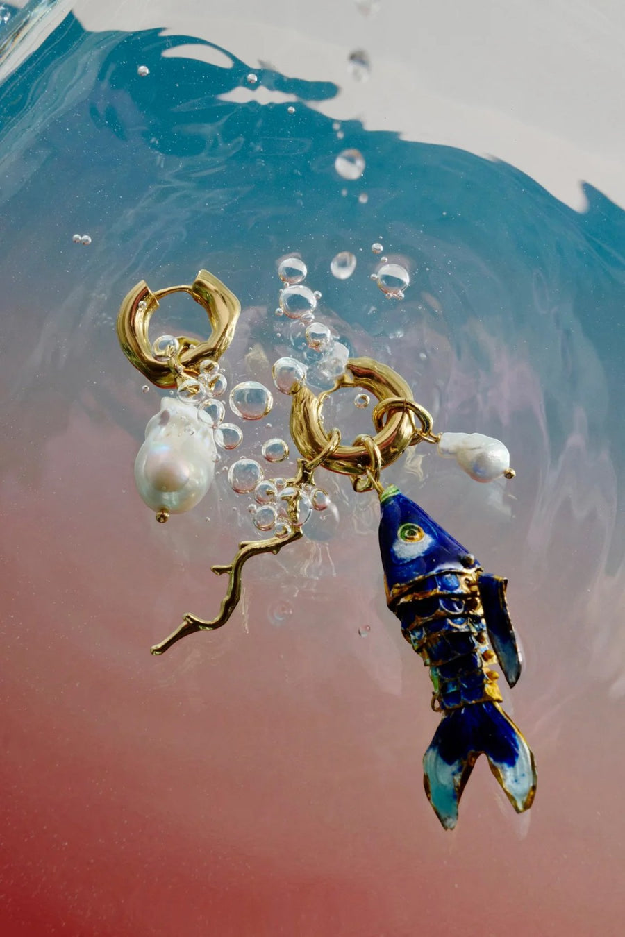 Martha Calvo Barrier hoop earrings in 14KT gold plate with freshwater baroque pearl and removable fish and coral branch charms