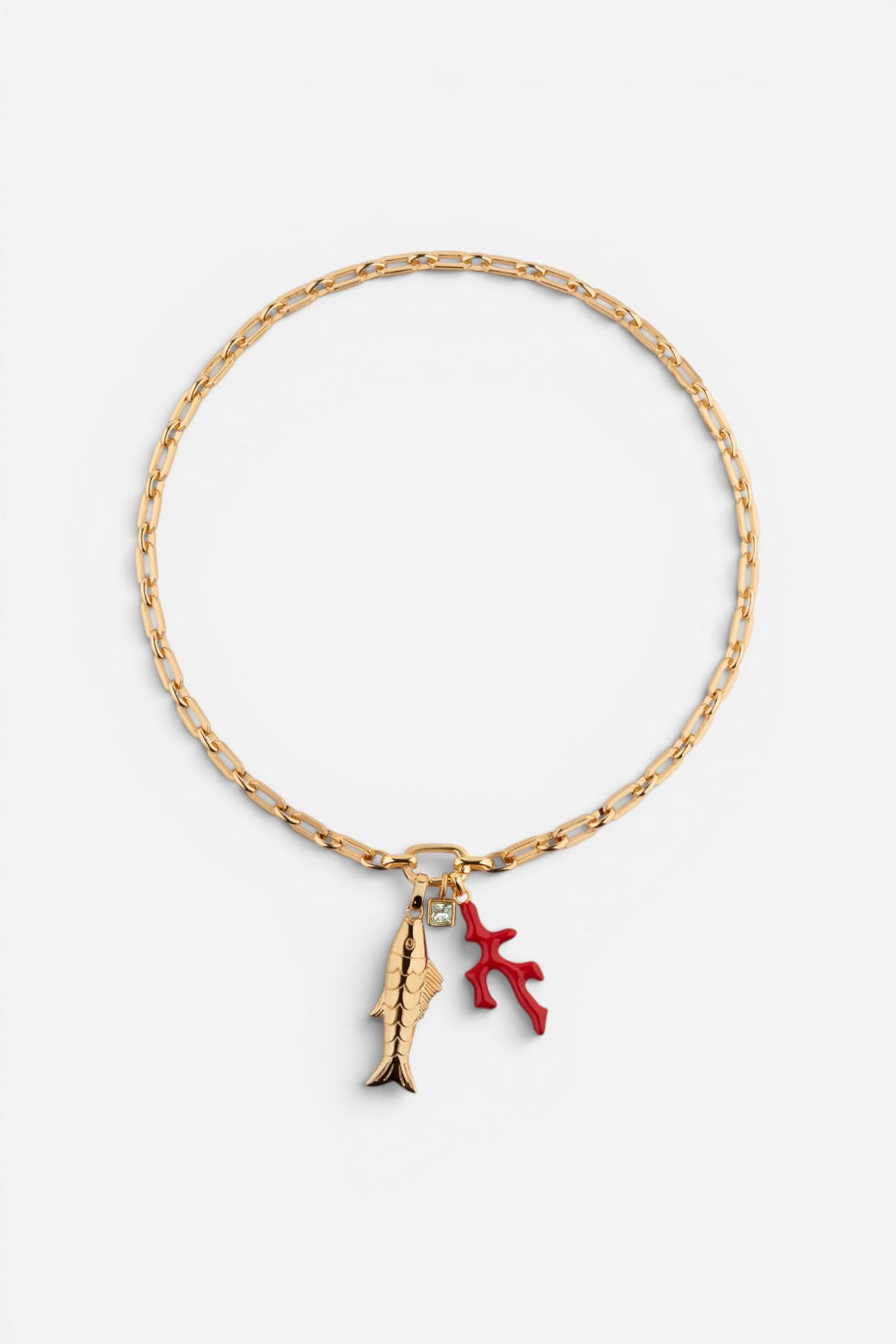 Martha Calvo Barrier necklace with a gold fish pendant and red enamel coral charm on a gold plate chain.