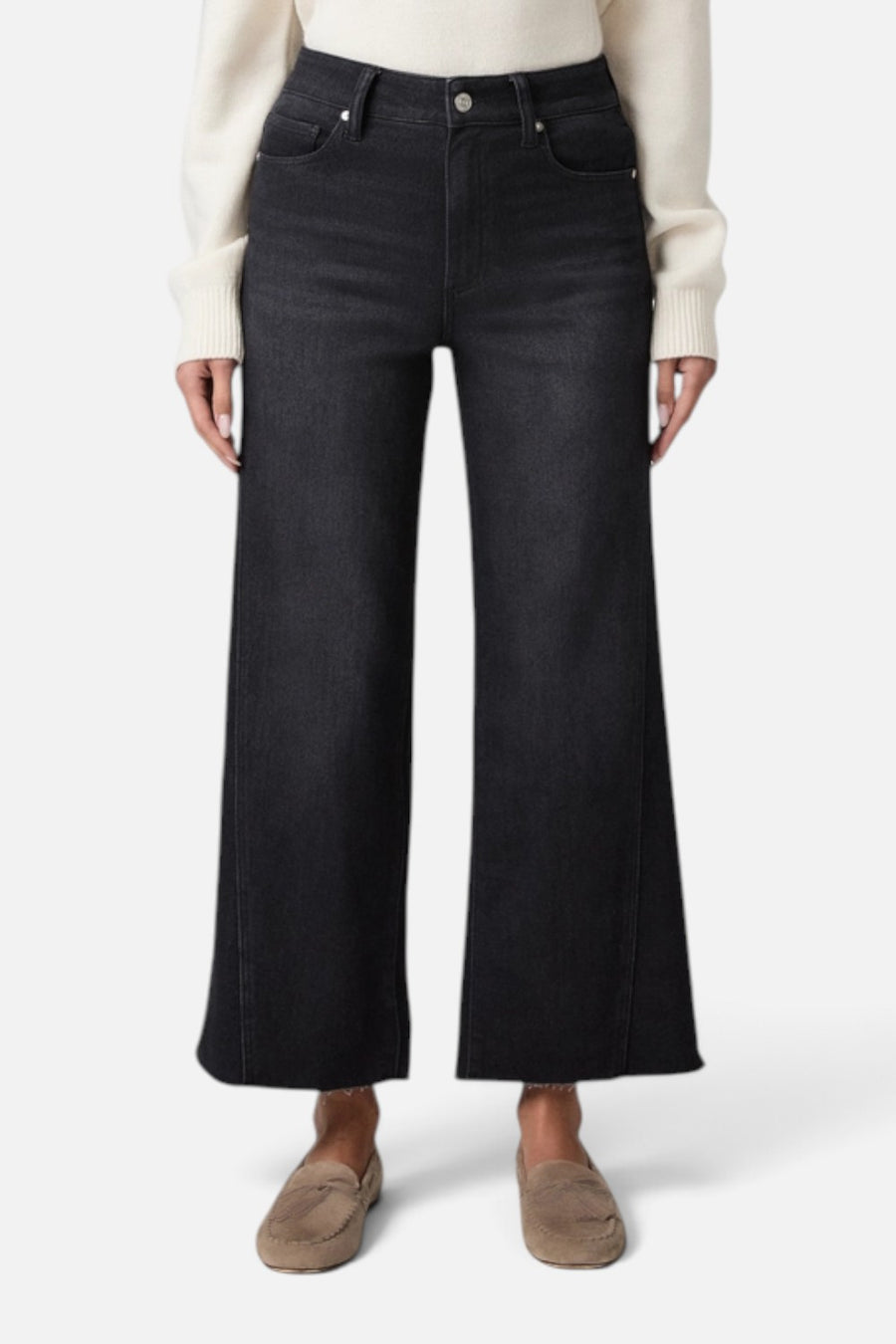 Paige Anessa wide leg high rise jean in ink black denim with twist outseam and raw hem, on model.