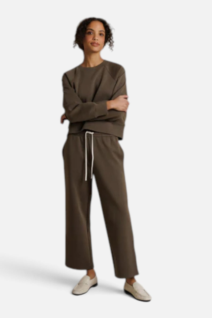 Perfect White Tee Claud travel track pant in dark olive with side stripes, front view.