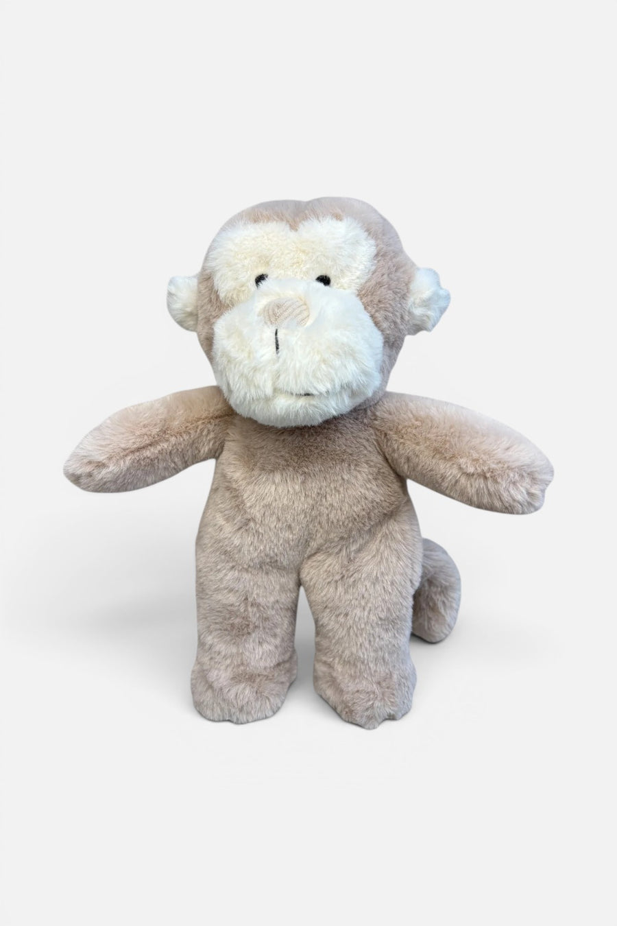 The Little Dog Laughed Delores monkey plush toy, front view.