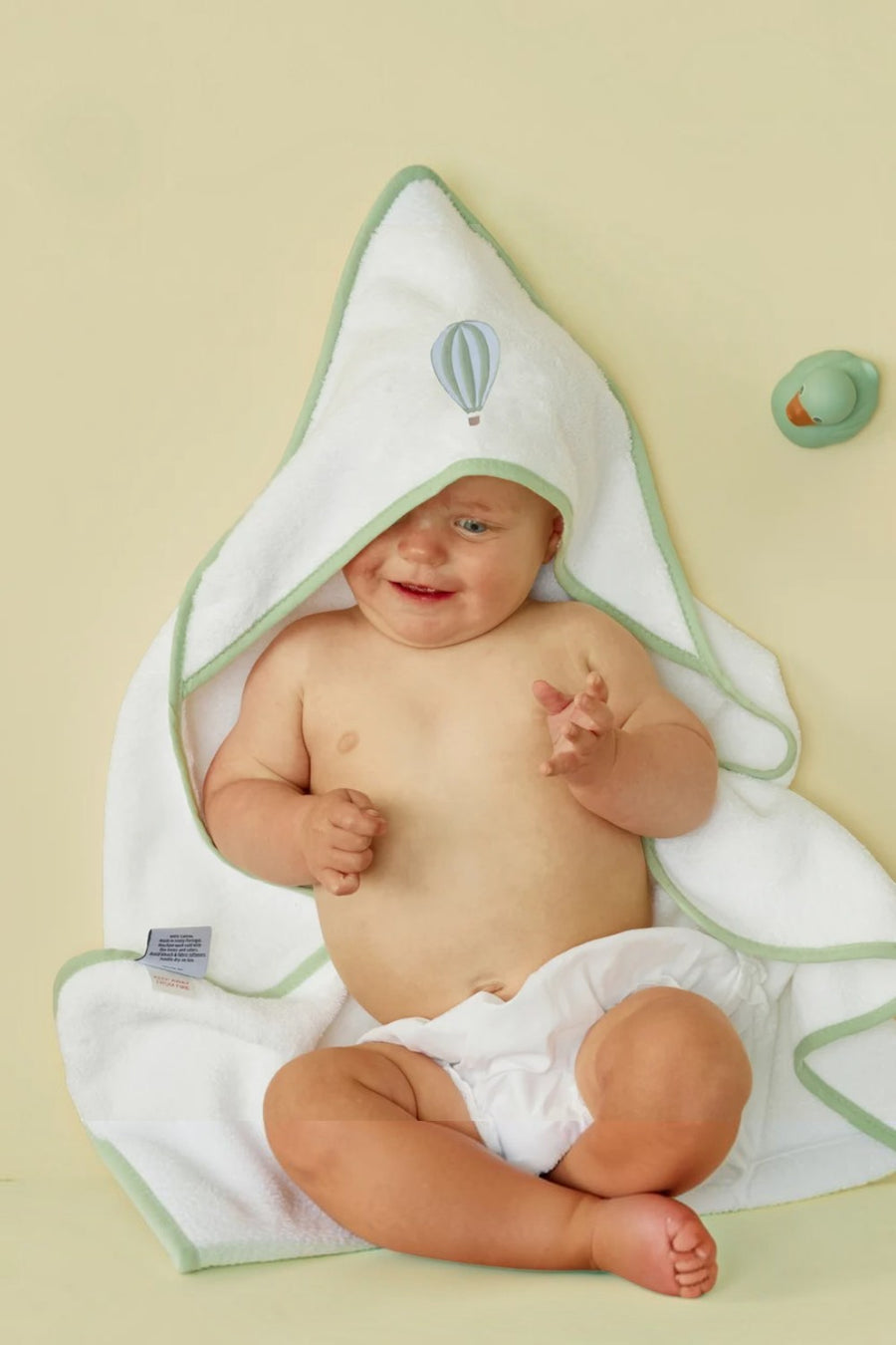 Weezie Ballon baby hooded towel in white organic cotton with blue piped details, alternate view 2