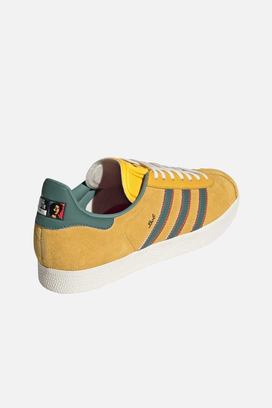 Adidas Gazelle Jamaica x Bob Marley Sneakers in Bold Gold & Pure Ruby – three-quarter view