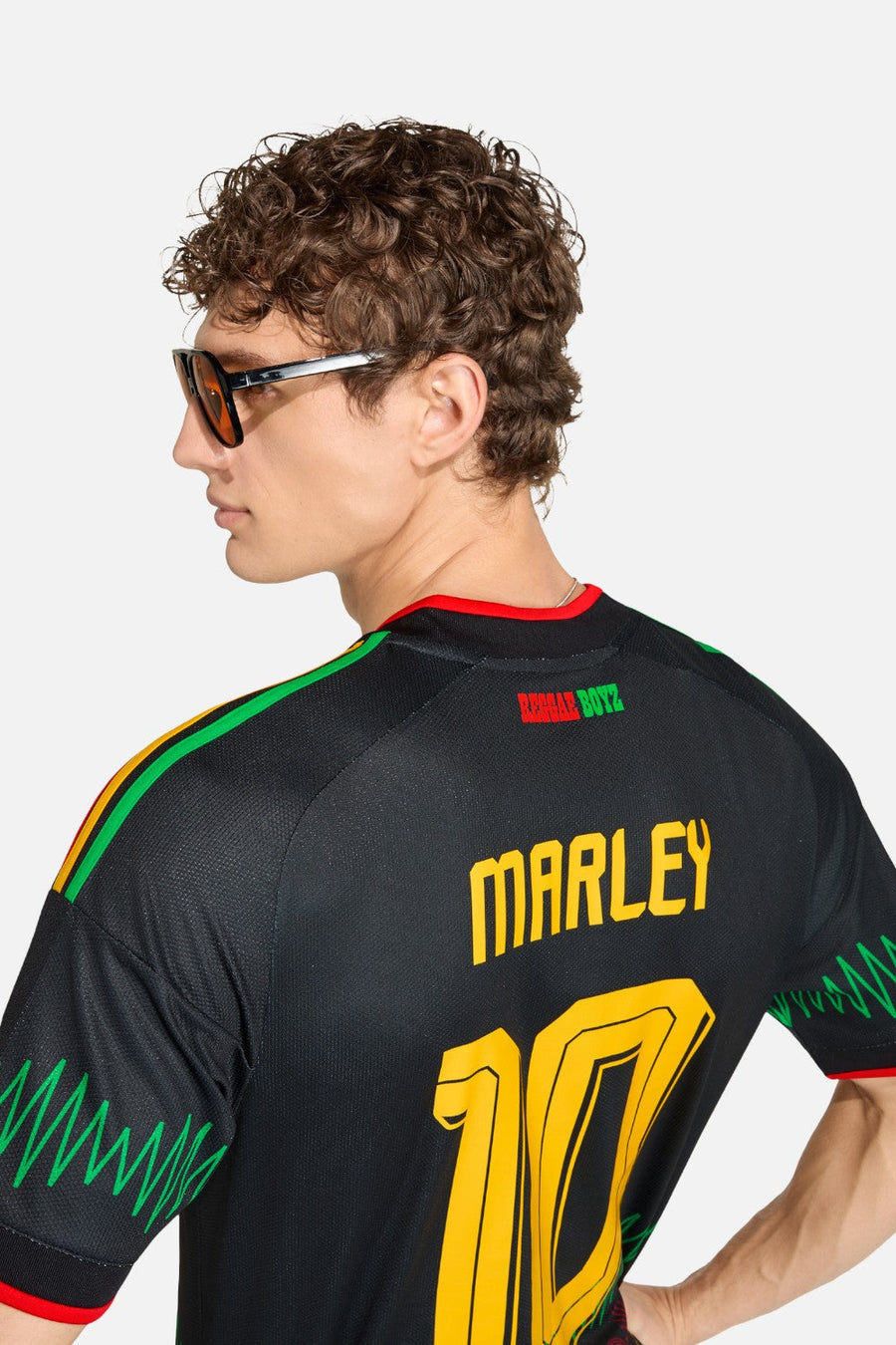 Adidas Jamaica 26 x Bob Marley Away Jersey in Black & Gold – flat lay