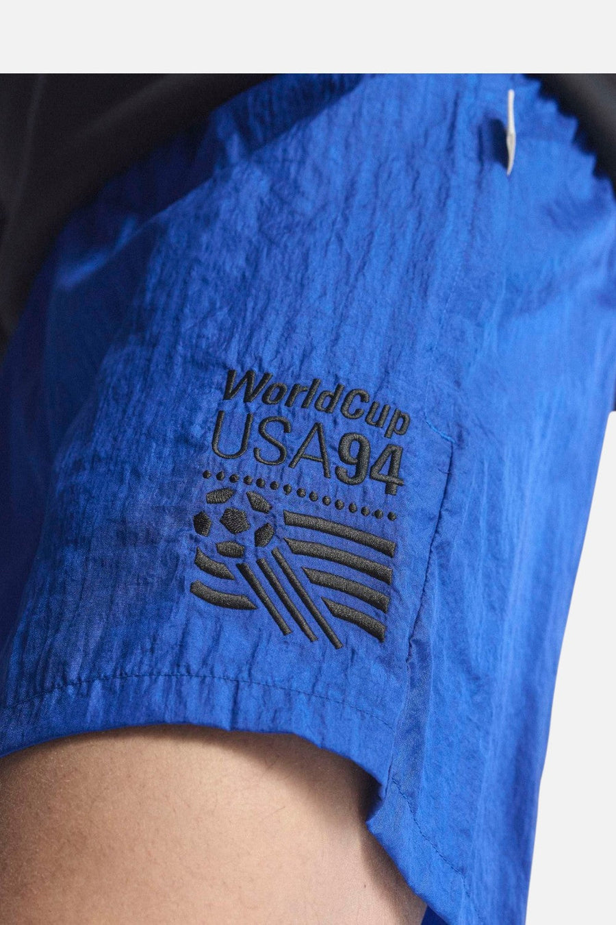 Adidas USA 94 Graphic Shorts in Royal Blue – flat lay