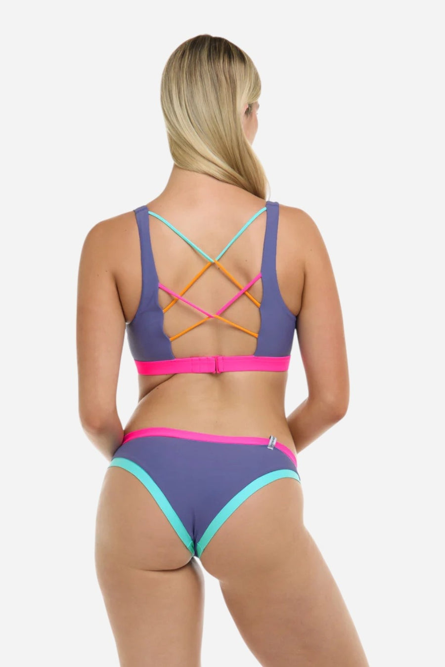 Body Glove Vibration Cross-Over Star Sports Bra in Iris – on model