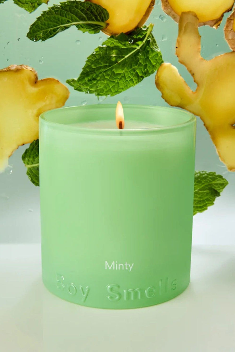 Boy Smells Minty Candle – side view