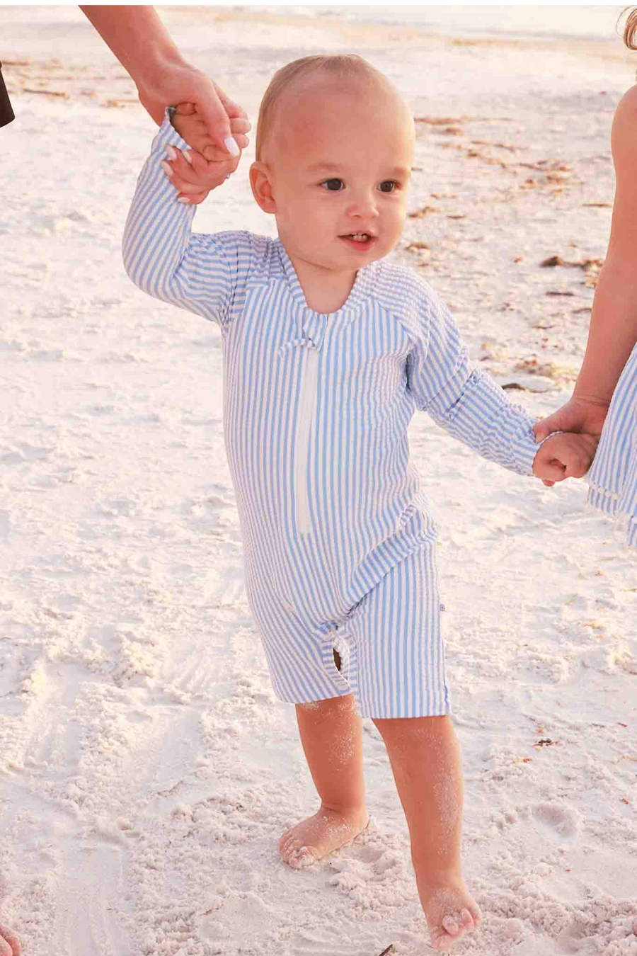 Caden Lane Long Sleeve Swim Romper in Blue Seersucker – flat lay