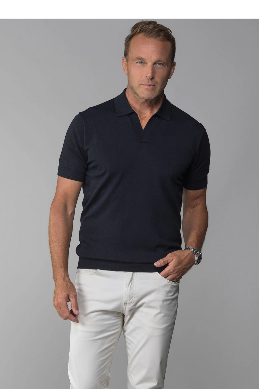 Collars & Co Maranello Mid-Weight Cotton & Silk Buttonless Polo in Black – flat lay