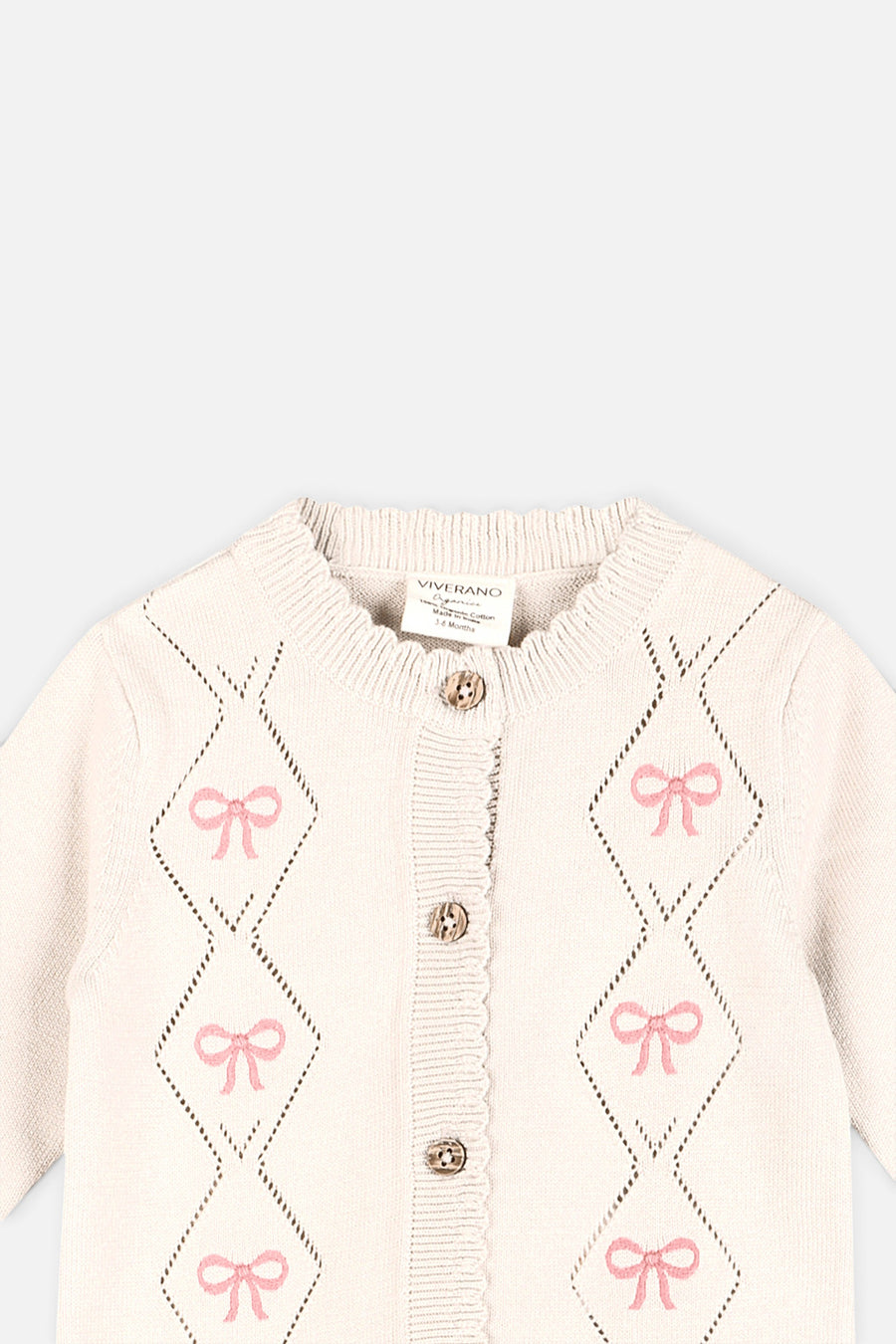 Evie Bow Pointelle Knit Baby Jumpsuit in Ecru – detail
