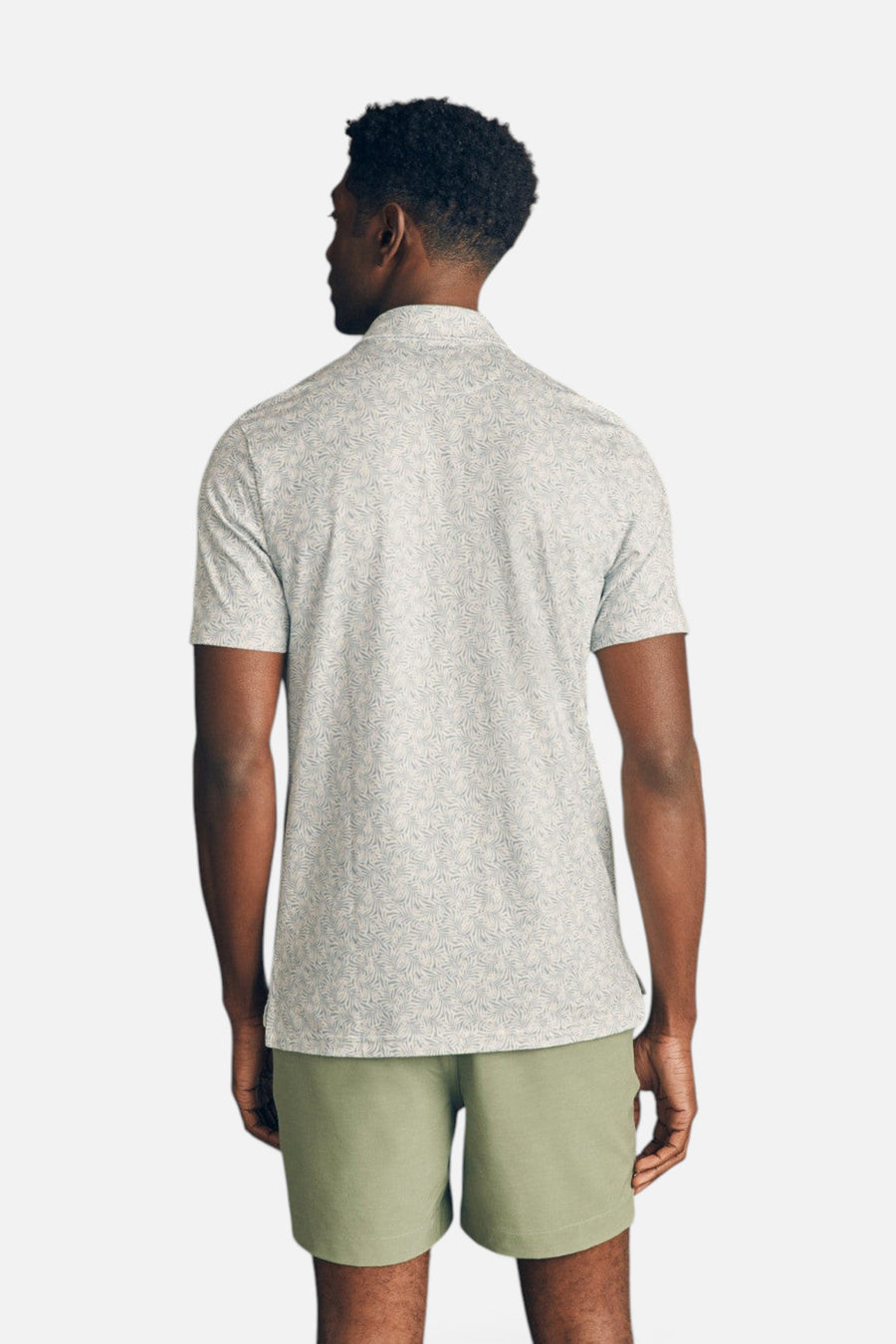 Faherty Movement Short-Sleeve Pique Polo Shirt in Sky Canopy Print – flat lay
