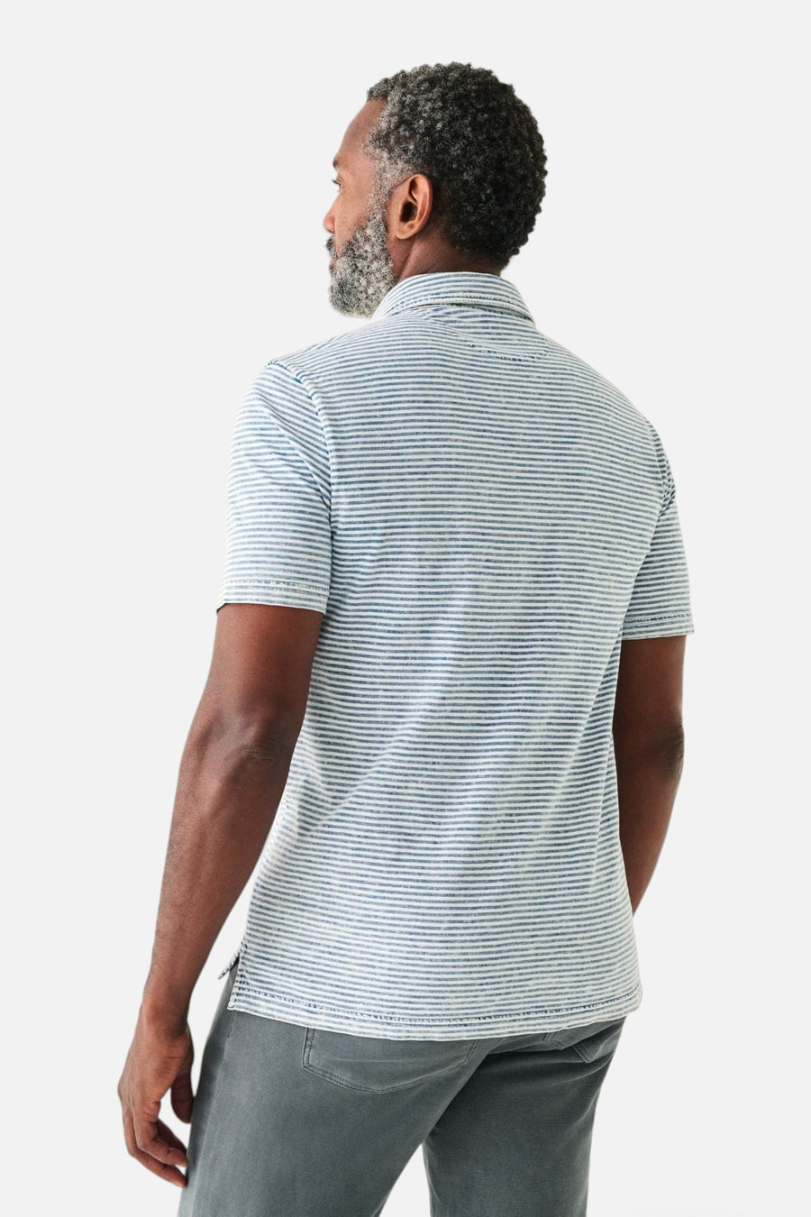 Faherty Short Sleeve Indigo Polo in Salt Wash Indigo Stripe – on model