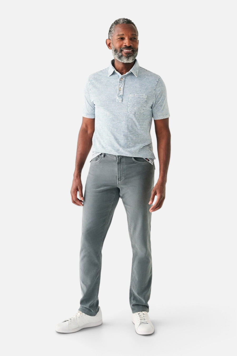 Faherty Short Sleeve Indigo Polo in Salt Wash Indigo Stripe – on model