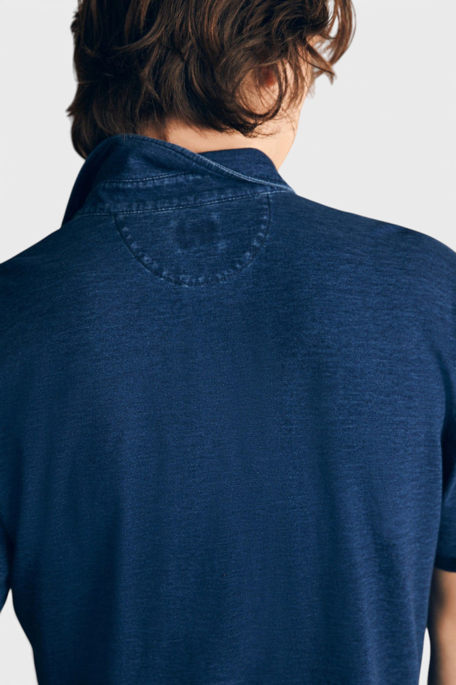 Faherty Short-Sleeve Indigo Polo Shirt in Midnight Wash – flat lay