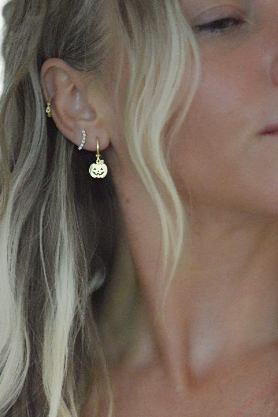 Farrah B Pumpkin Huggies Earrings in Gold – back view
