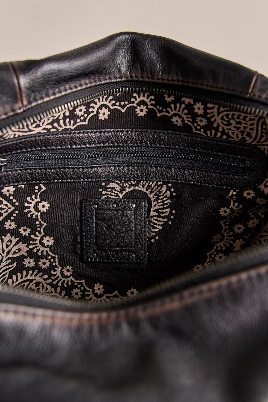 Free People Emerson leather tote in black, interior view.