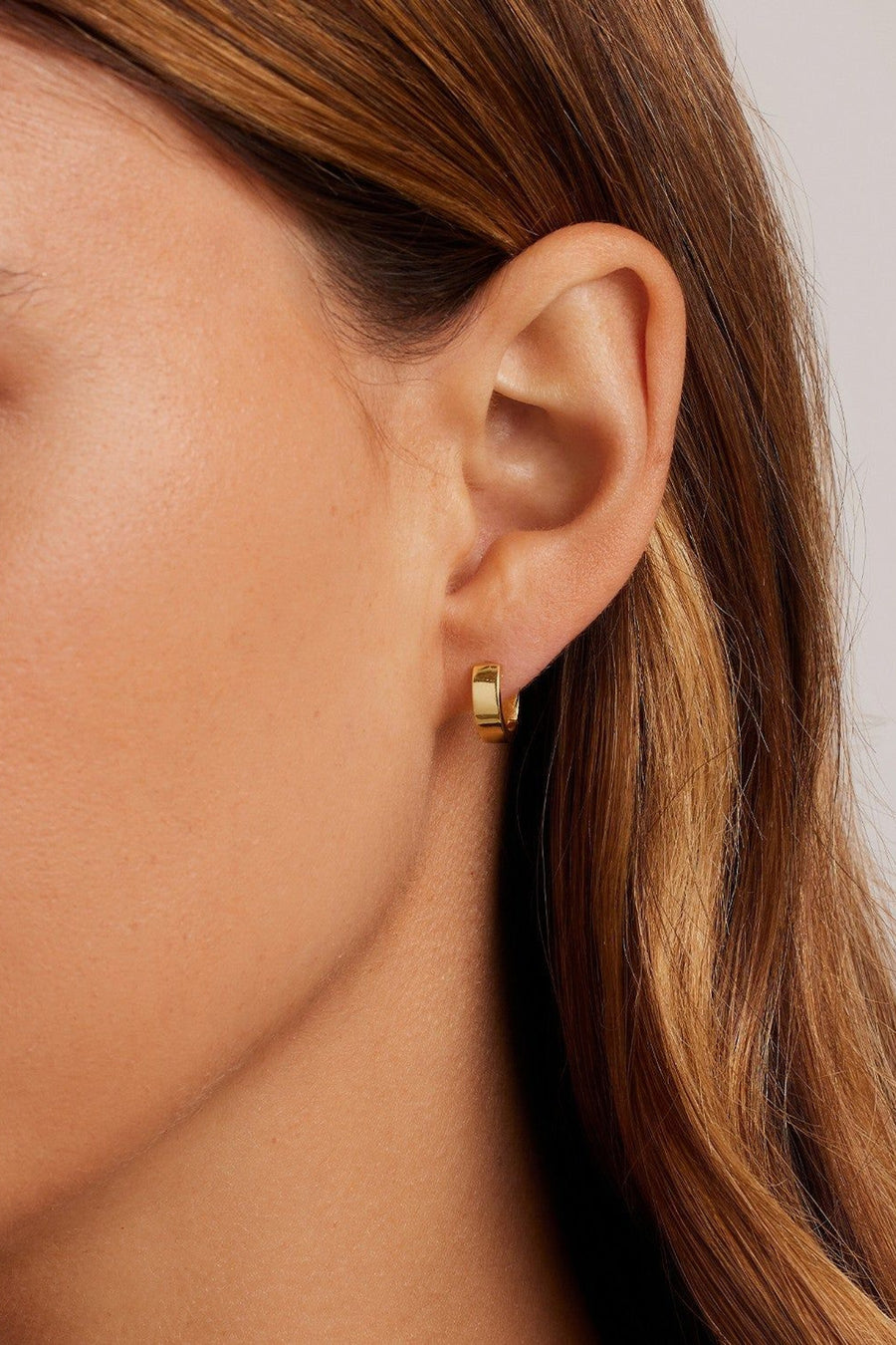 Gorjana Rose Huggies Earrings in Gold – detail