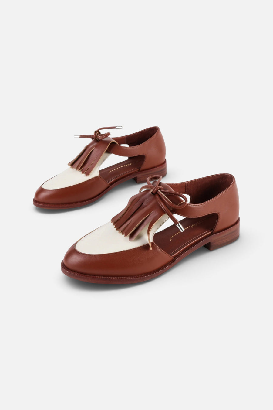 Intentionally Blank Tock Cutout Tassel Oxford in Tan Combo – front view