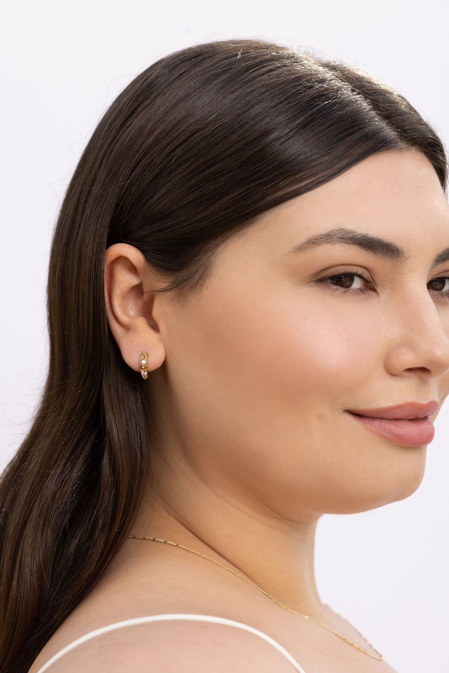 Kaia Huggies Earrings in Gold – side view