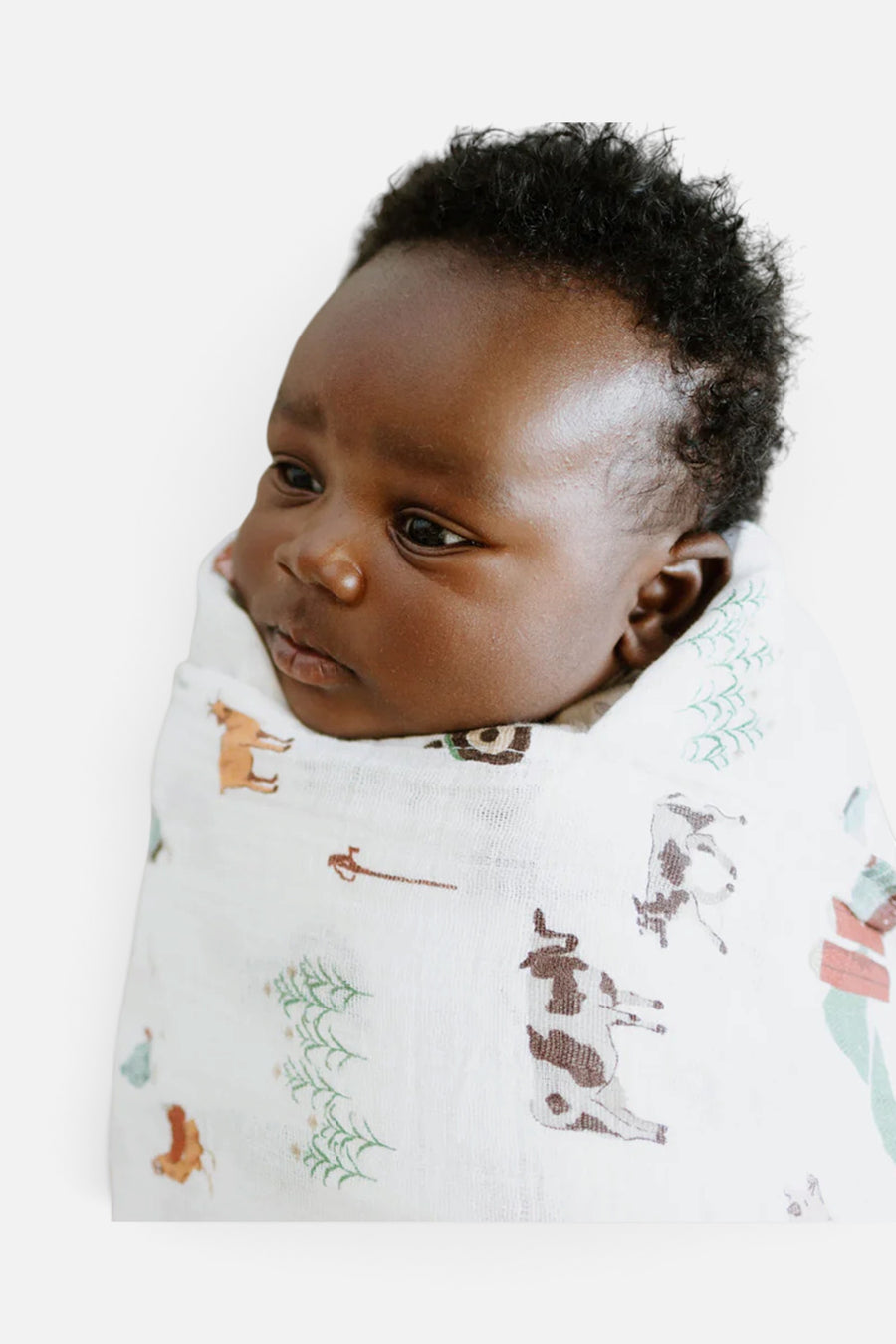 Little Unicorn Cotton Muslin Swaddle Blanket in Farmyard – flat lay