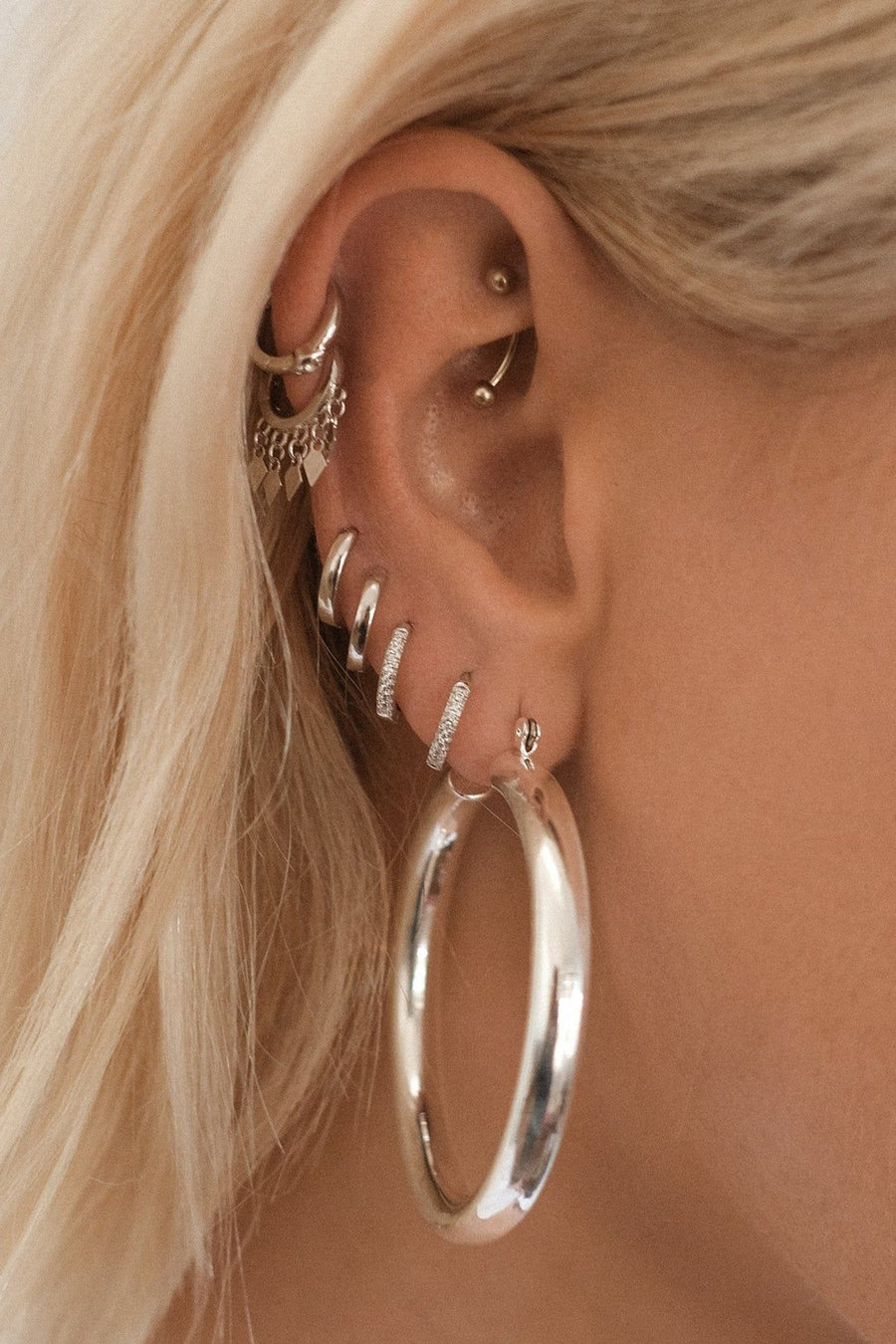 Luv AJ Sorrento Huggie Earrings in Silver – side view