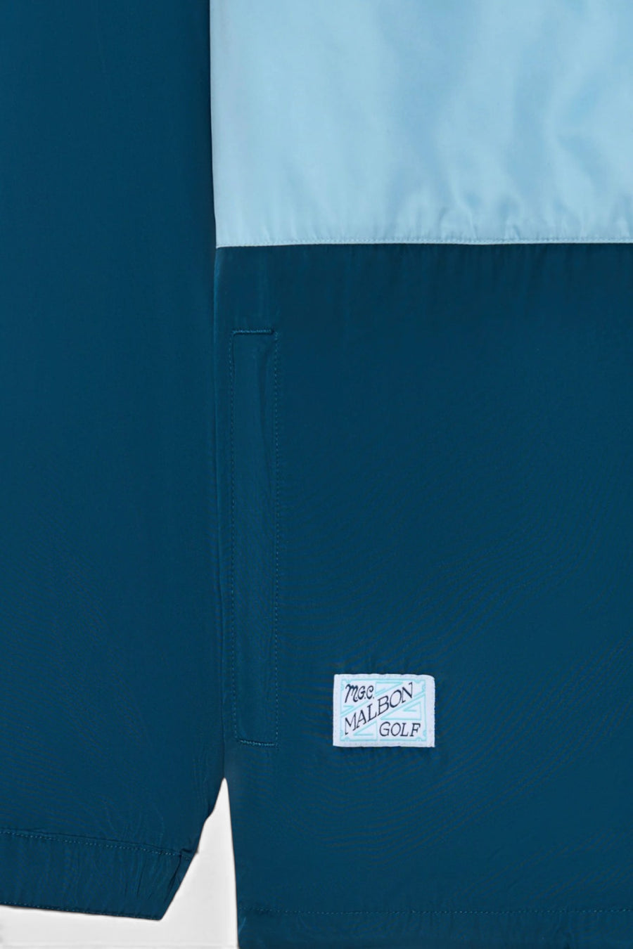 Malbon Golf Costanzo Windbreaker in Ocean – side view