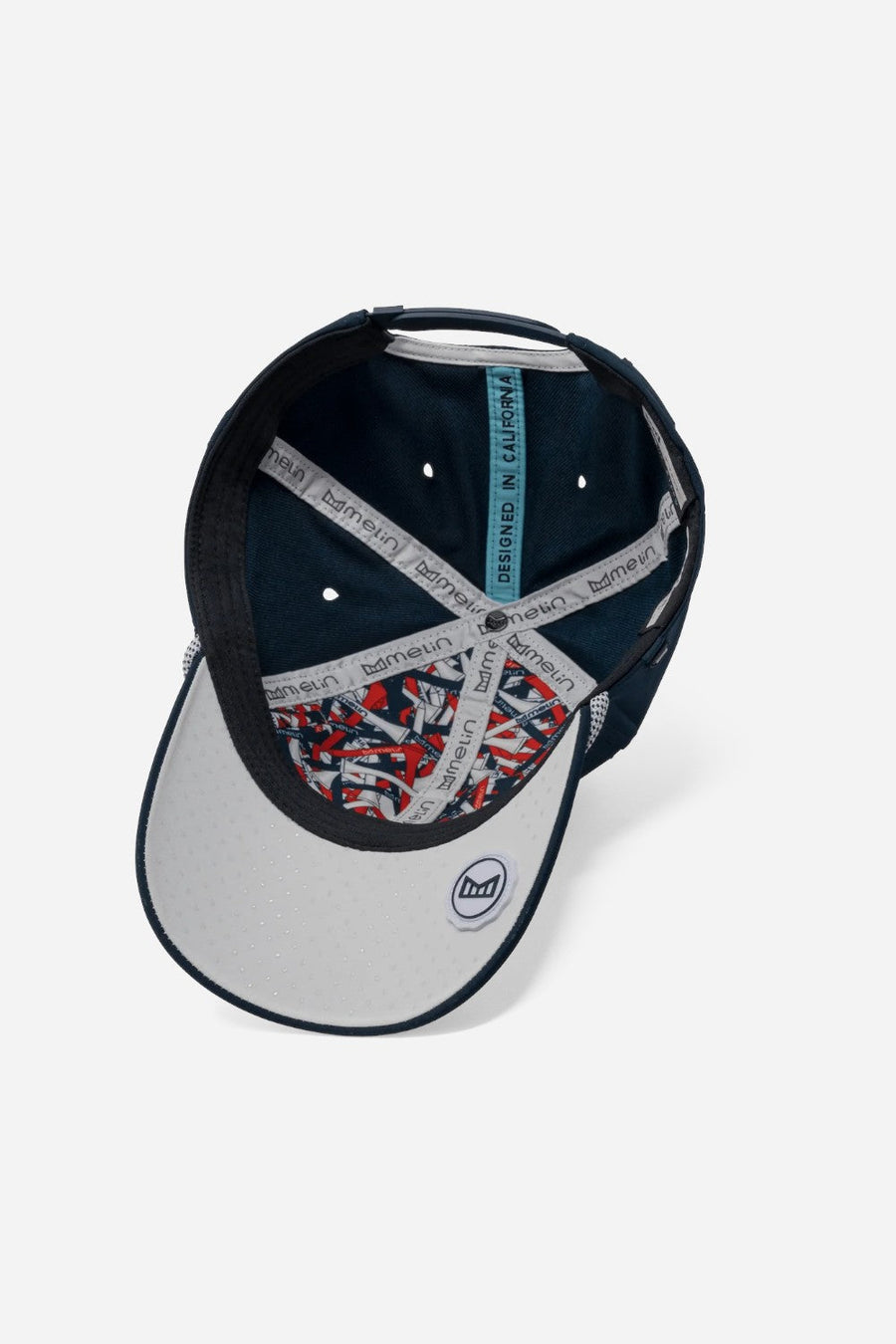 Melin A-Game Links Drive Hydro Hat in Navy/White – flat lay