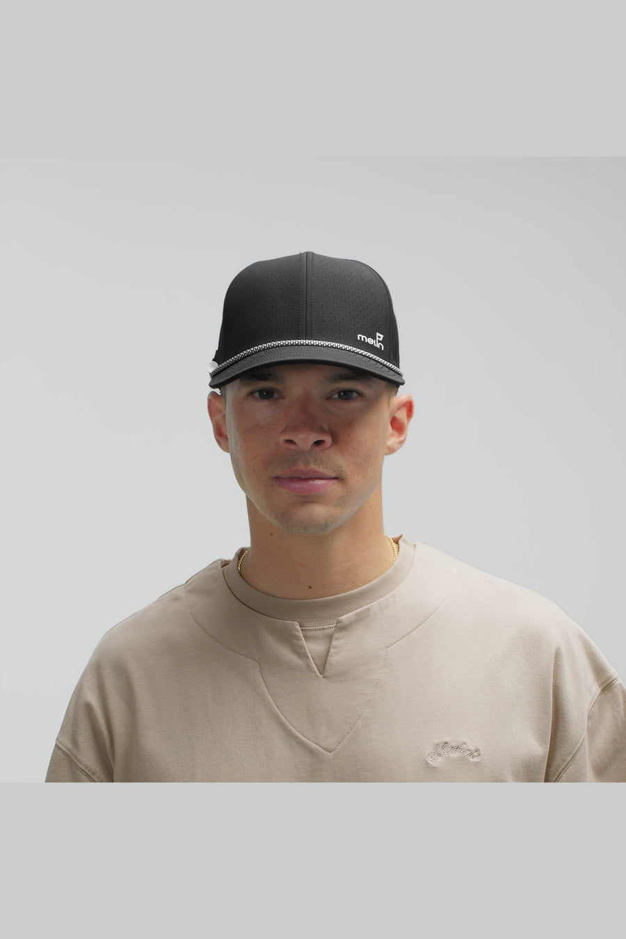 Melin Compass Links Hydro Hat in Black – on model
