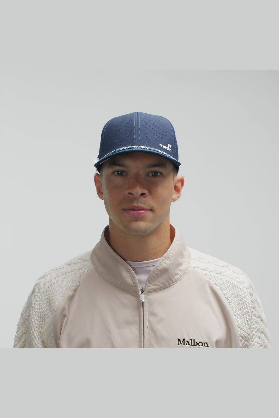 Melin Compass Links Hydro Hat in Navy – on model