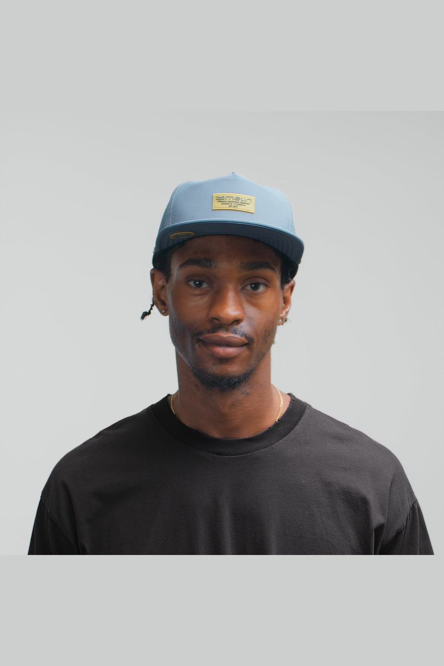 Melin Coronado Brick Hydro Hat in Blue Stone/Gum – on model