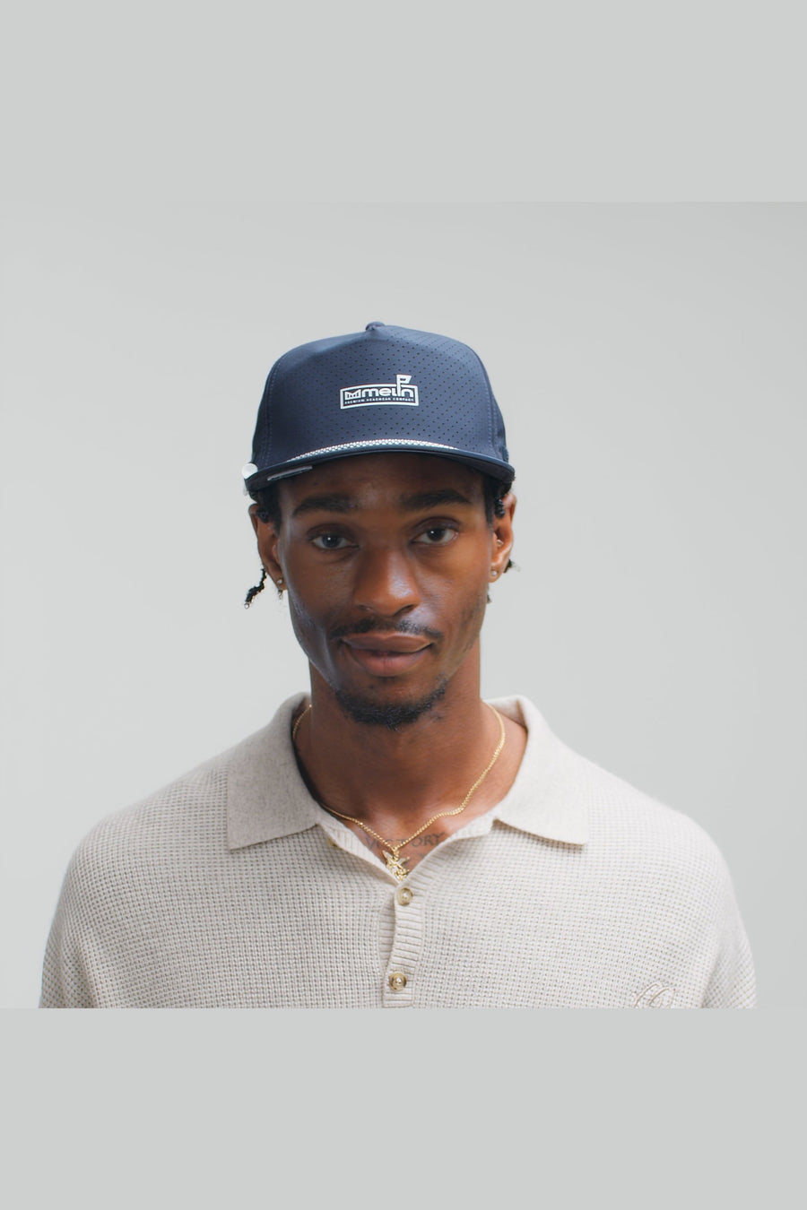 Melin Coronado Links Hydro Hat in Navy – on model