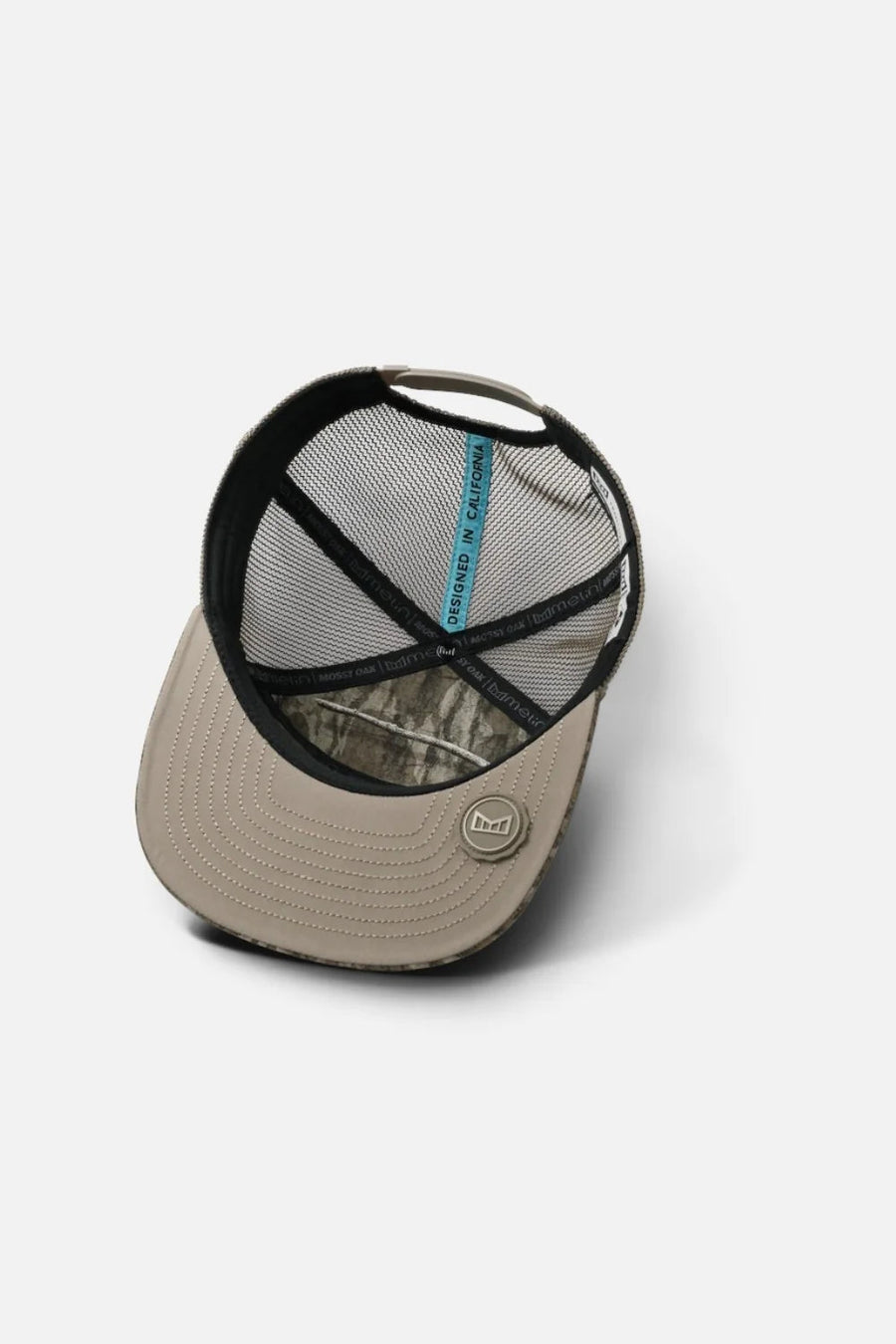 Melin Hydro Trenches Mossy Oak Cap in Bottomland – flat lay