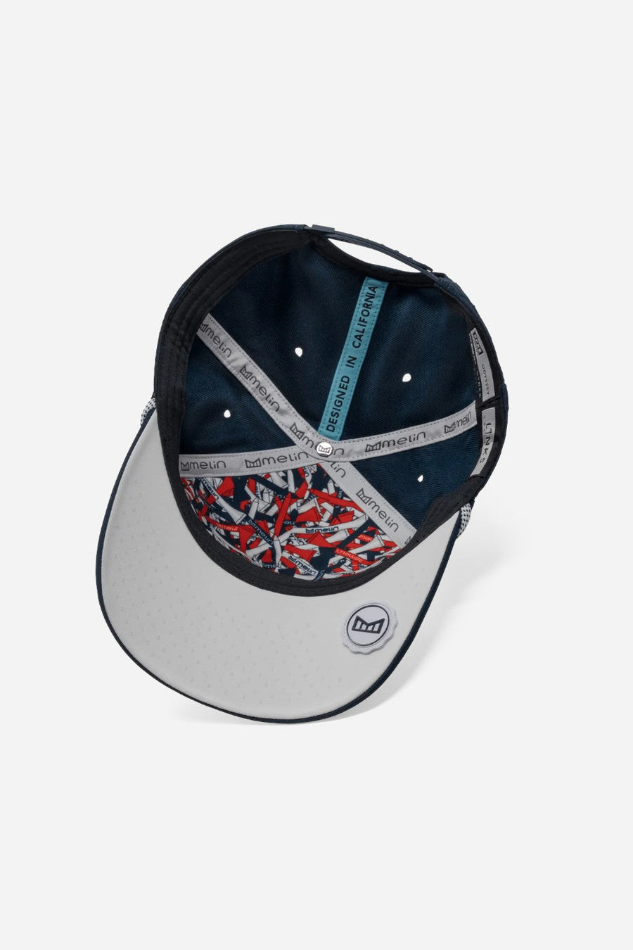 Melin Odysea Links Hydro Hat in Navy/White – flat lay