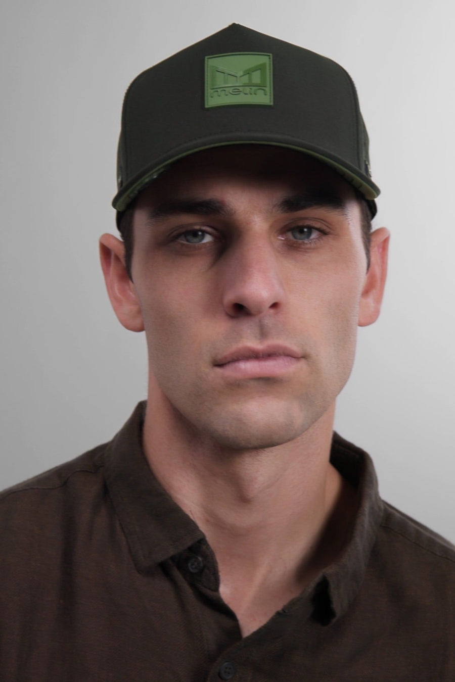 Melin Odysea Stacked Hydro Hat in Black Forest – flat lay