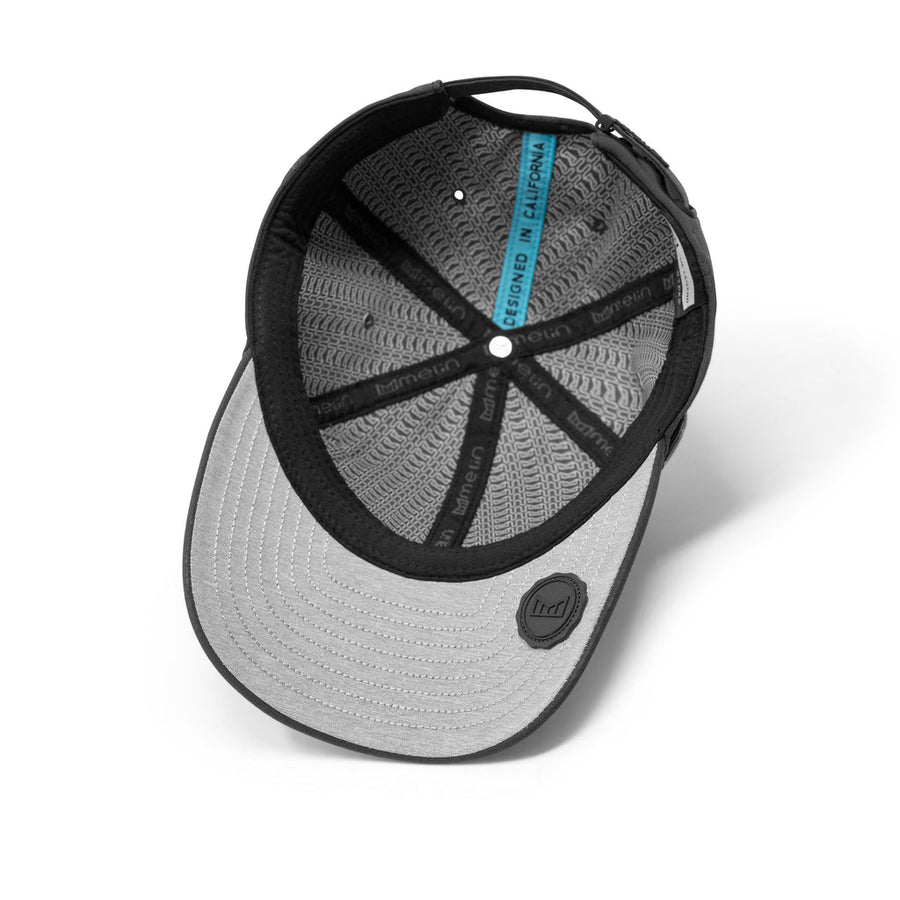 Melin The Legend Hydro Hat in Black – flat lay